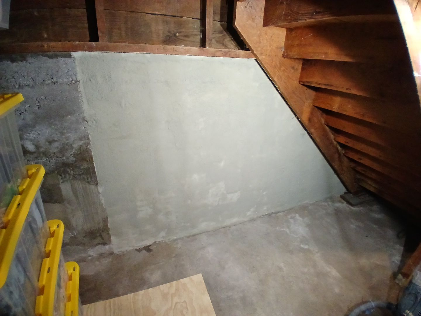 Old house foundation wall repair and renovate with installing metal sheets for waterproofing and protect from rain. Foundation repair